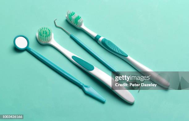 hygienist's cleaning dental tools - dentist phobia stock-fotos und bilder