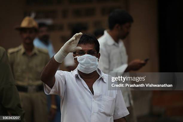 Officials call relatives of deceased passengers to identify their family members on May 23, 2010in Mangalore. An Air India Express Boeing 737-800...