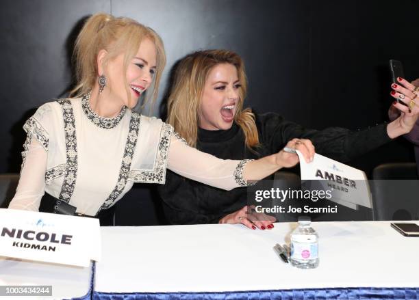 Nicole Kidman and Amber Heard take a selfie at DC Entertainment's Warner Bros. Pictures 'Aquaman' Autograph Signing during Comic-Con International...