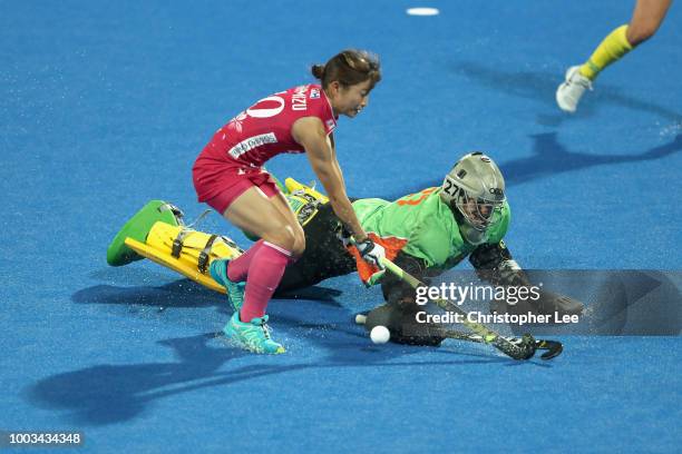 Goalkeeper Rachael Lynch of Australia stops Minami Shimizu of Japan during the Pool D game between Australia and Japan of the FIH Womens Hockey World...
