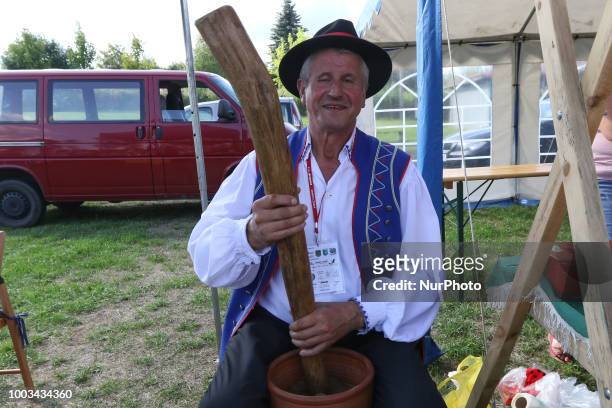 Kashub man grinding tobacco in a traditional way to obtain snuff is seen in Chmielno, Kashubia region, Poland on 21 July 2018 Kashubs or Kashubians...
