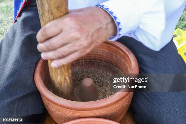 Kashub man grinding tobacco in a traditional way to obtain snuff is seen in Chmielno, Kashubia region, Poland on 21 July 2018 Kashubs or Kashubians...