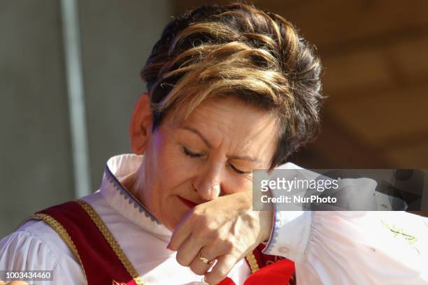 Woman taking snuff from traditional Kashubian snuff box made of cow horn is seen in Chmielno, Kashubia region, Poland on 21 July 2018 Kashubs or...