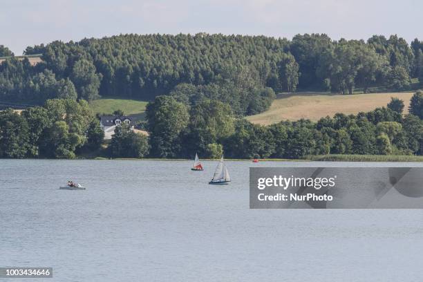 Sailboat on the lake is seen in Chmielno, Kashubia region, Poland on 21 July 2018 Kashubs or Kashubians have their own unique language and...