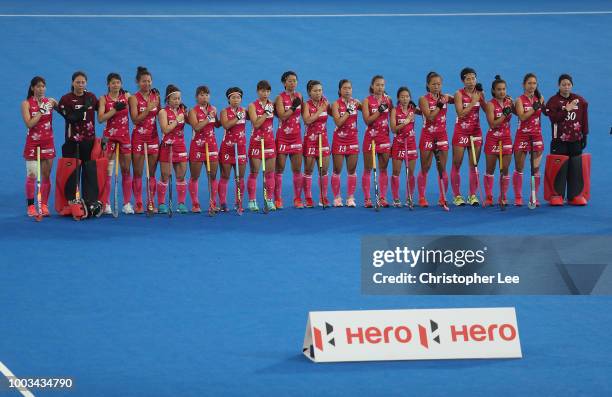 The Japan team stand for their National Anthem during the Pool D game between Australia and Japan of the FIH Womens Hockey World Cup at Lee Valley...