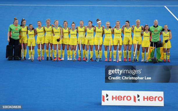 The Australia team stand for their national anthem during the Pool D game between Australia and Japan of the FIH Womens Hockey World Cup at Lee...