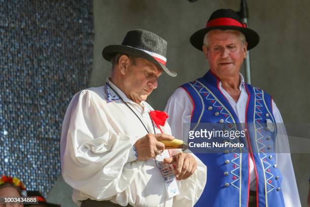 Man taking snuff from traditional Kashubian snuff box made of cow horn is seen in Chmielno, Kashubia region, Poland on 21 July 2018 Kashubs or...
