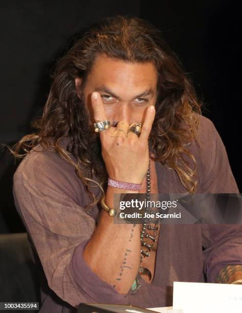 Jason Momoa attends DC Entertainment's Warner Bros. Pictures 'Aquaman' Autograph Signing during Comic-Con International 2018 at San Diego Convention...