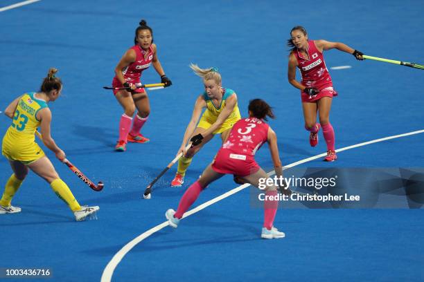 Stephanie Kershaw of Australia takes on the Japan defence during the Pool D game between Australia and Japan of the FIH Womens Hockey World Cup at...
