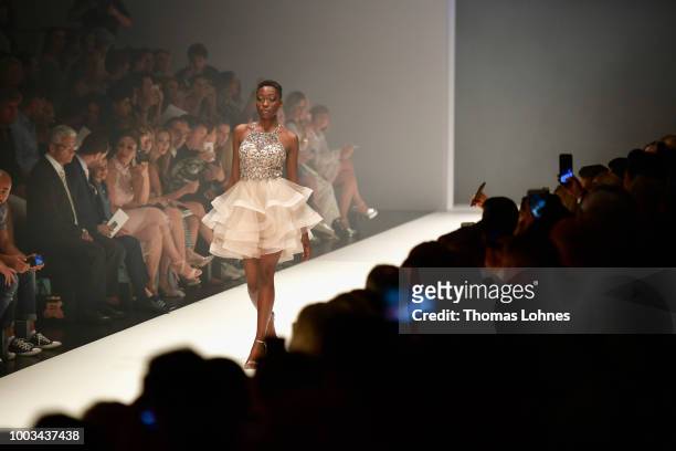 Toni Dreher-Adenuga walks the runway at the Unique by Lexus show during Platform Fashion July 2018 at Areal Boehler on July 21, 2018 in Duesseldorf,...