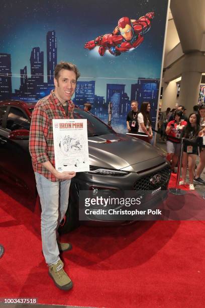 Todd Nauck stops by the Marvel booth to pose with the Hyundai Kona Iron Man Edition at San Diego Comic-Con 2018 at the San Diego Convention Center on...