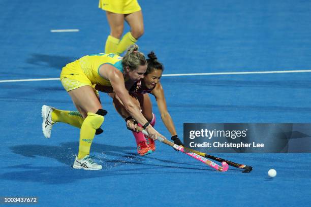 Edwina Bone of Australia battles with Motomi Kawamura of Japan during the Pool D game between Australia and Japan of the FIH Womens Hockey World Cup...