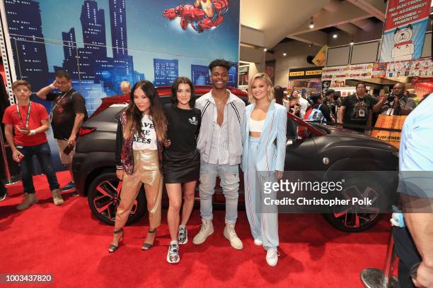 Ally Maki, Emma Lahana, Aubrey Joseph and Olivia Holt of Marvel's Cloak and Dagger stop by the Marvel booth to pose with the Hyundai Kona Iron Man...