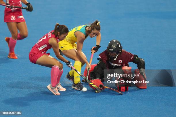 Megumi Kageyama of Japan stops Grace Stewart of Australia during the Pool D game between Australia and Japan of the FIH Womens Hockey World Cup at...