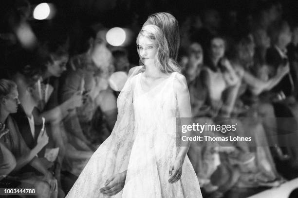 Model walks the runway at the Unique by Lexus show during Platform Fashion July 2018 at Areal Boehler on July 21, 2018 in Duesseldorf, Germany.