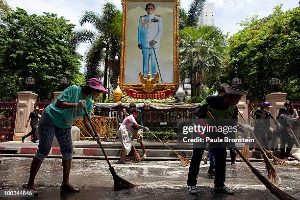 Hundreds of Bangkok residents participate in a Bangkok Clean Up day sweeping up the streets with soap and water May 23, 2010 in Bangkok, Thailand. A...