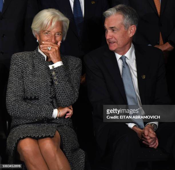 Director Christine Lagarde speaks with US Chairman of the Federal Reserve Jerome Powell during the family picture of the G20 Finance Ministers and...