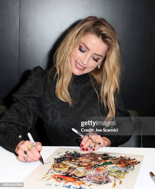 Amber Heard attends DC Entertainment's Warner Bros. Pictures 'Aquaman' Autograph Signing during Comic-Con International 2018 at San Diego Convention...