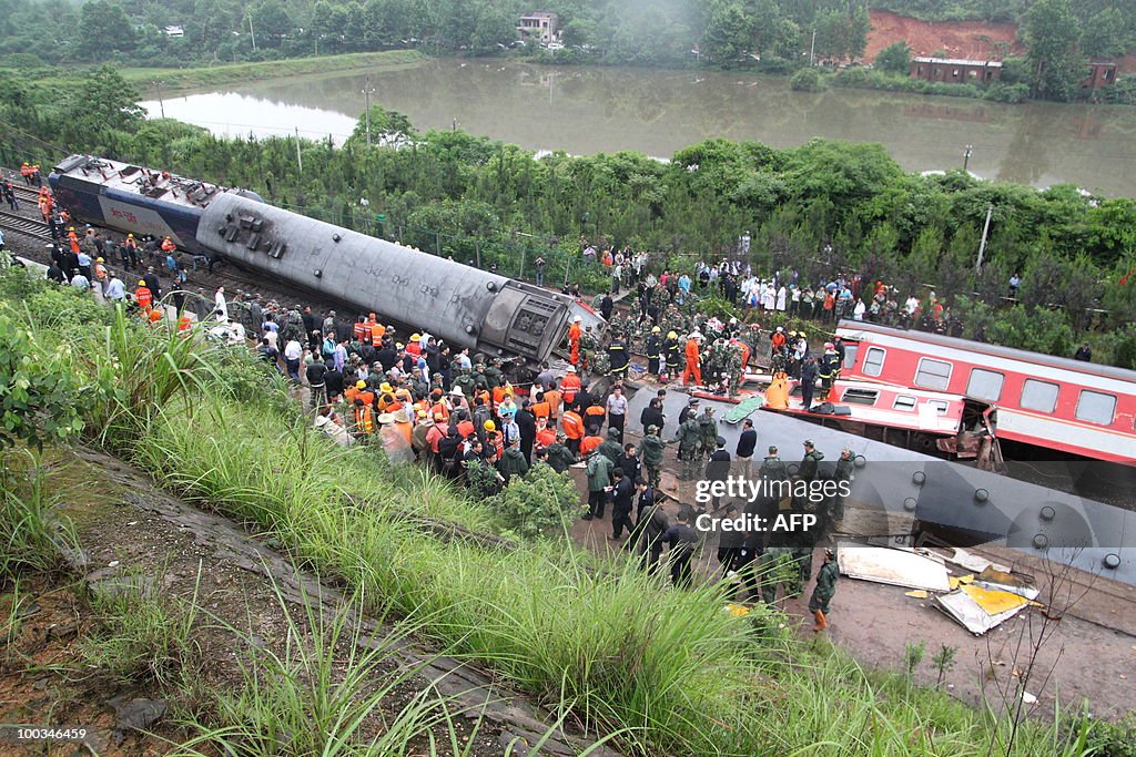 Chinese rescuers check the twisted wreck