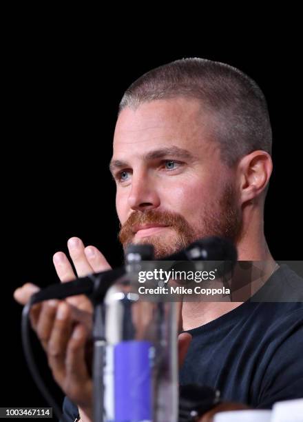 Stephen Amell speaks onstage at the "Arrow" Special Video Presentation and Q&A during Comic-Con International 2018 at San Diego Convention Center on...