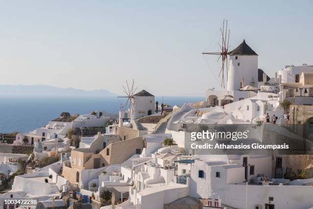 Traditional Windmill at Oia village on July 16, 2018 in Santorini, Greece.