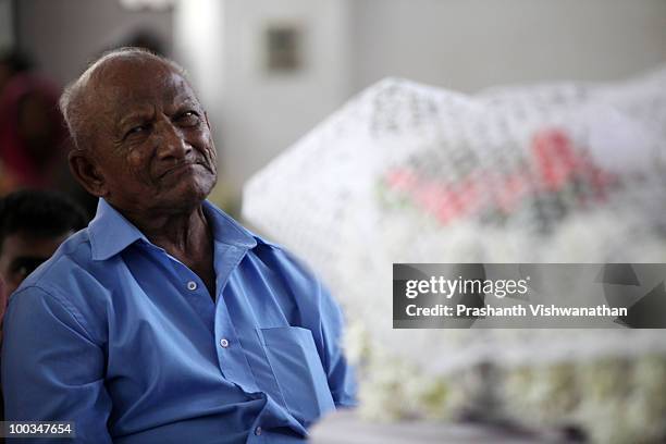 The father of Air India Express plane crash victim H.Rosaline attends the funeral service for his daughter and granddaughters H.Goldine and H.Gloria,...