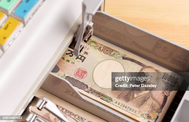 japanese yen currency in till/ cash register - yen sign stock pictures, royalty-free photos & images