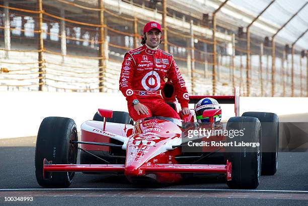 Dario Franchitti of Scotland, driver of the Target Chip Ganassi Racing Dallara Honda, poses on the front stretch after qualifying in third position...