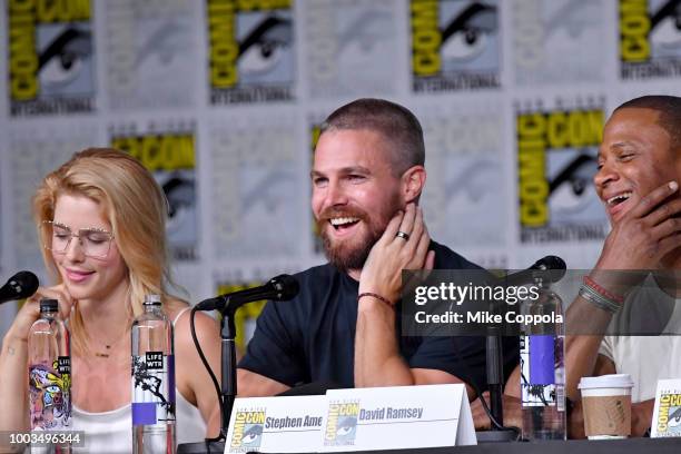 Emily Bett Rickards, Stephen Amell and David Ramsey onstage at the "Arrow" Special Video Presentation and Q&A during Comic-Con International 2018 at...