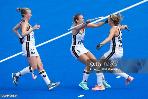 Viktoria Huse of Germany celebrates scoring her side's third goal with team mates Anne Schroder and Franzisca Hauke during the Pool C game between...
