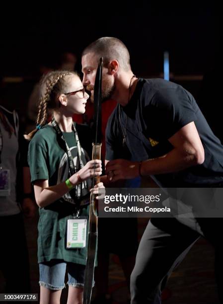 Stephen Amell with a fan at the "Arrow" Special Video Presentation and Q&A during Comic-Con International 2018 at San Diego Convention Center on July...