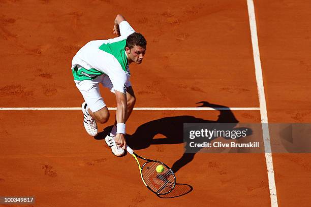 Daniel Brands of Germany plays a volley during the men's singles first round match between Jo-Wilfried Tsonga of France and Daniel Brands of Germany...