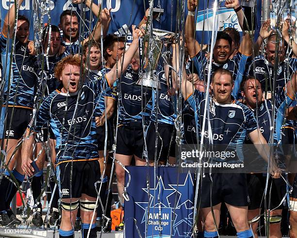 Gethin Jenkins , the Cardiff captain races the trophy with Paul Tito as their team celebrate victory during the Amlin Challenge Cup Final between...