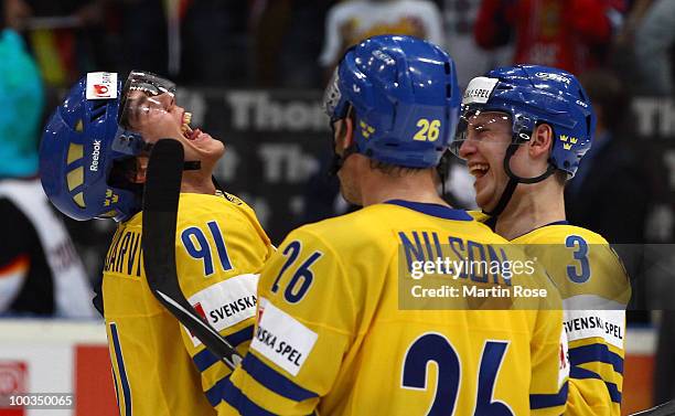 Magnus Paajarvi of Sweden celebrate with his team mates Marcus Nilson and Oliver Ekmann after winning the IIHF World Championship bronze medal match...