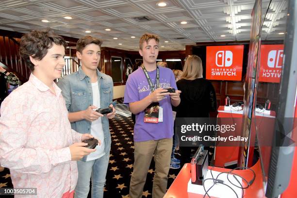 Jack Dylan Grazer and Asher Angel test their skills on Super Smash Bros. Ultimate for Nintendo Switch at the Variety Studio at Comic-Con 2018 on July...