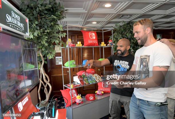 Khary Payton and Brooks Wheelan test their skills on Super Smash Bros. Ultimate for Nintendo Switch at the Variety Studio at Comic-Con 2018 on July...