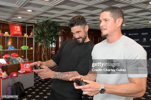 Clayton Cardenas and J. D. Pardo test their skills on Super Smash Bros. Ultimate for Nintendo Switch at the Variety Studio at Comic-Con 2018 on July...