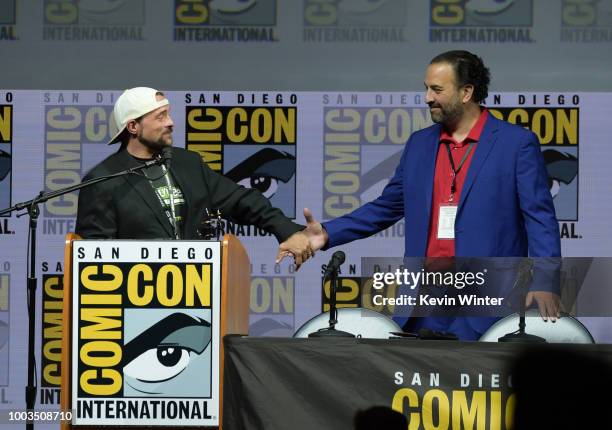 Kevin Smith accepts an Inkpot Award from Comic-Con International Director of Programming Eddie Ibrahim at 'An Evening with Kevin Smith' during...