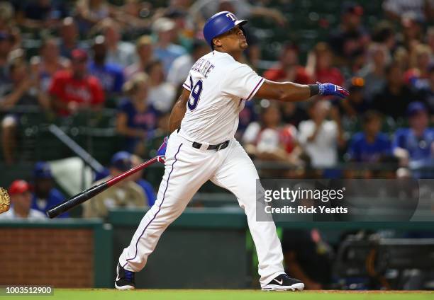 Adrian Beltre of the Texas Rangers hits a two run home run home run in the seventh inning against the Cleveland Indians at Globe Life Park in...