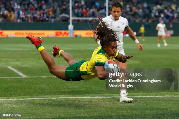 Ellia Green of Australia dives over to score a try against the United States in the Bronze medal match on day two of the Rugby World Cup Sevens at...