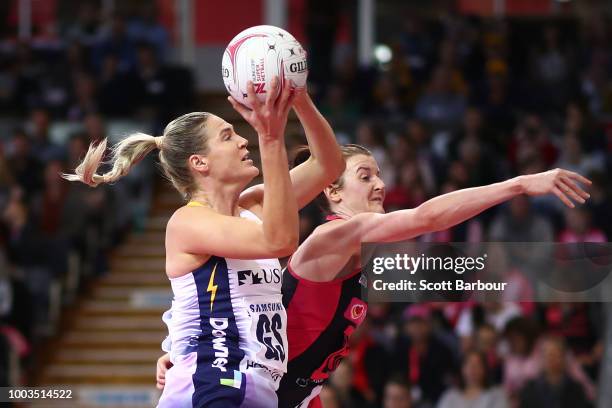 Caitlin Bassett of the Lightning and Kate Shimmin of the Thunderbirds compete for the ball during the Super Netball match between the Thunderbirds...