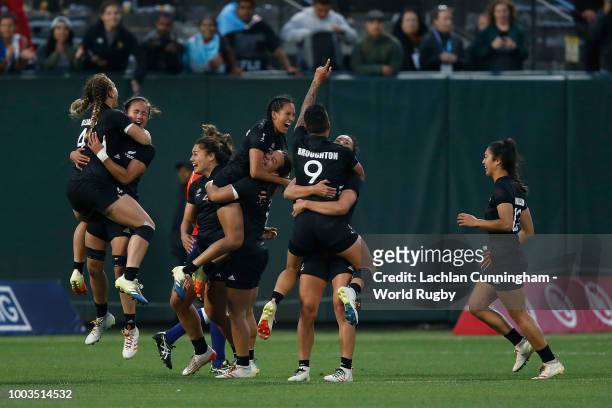 New Zealand players celebrate after winning the Championship match against France to win the 2018 Woman's Rugby World Cup Sevens at AT&T Park on July...