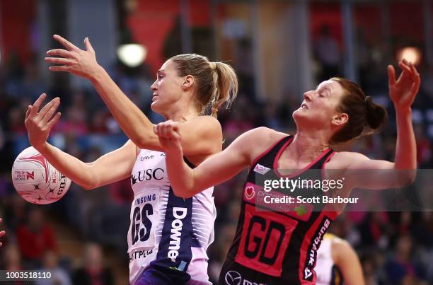 Caitlin Bassett of the Lightning and Kate Shimmin of the Thunderbirds compete for the ball during the Super Netball match between the Thunderbirds...