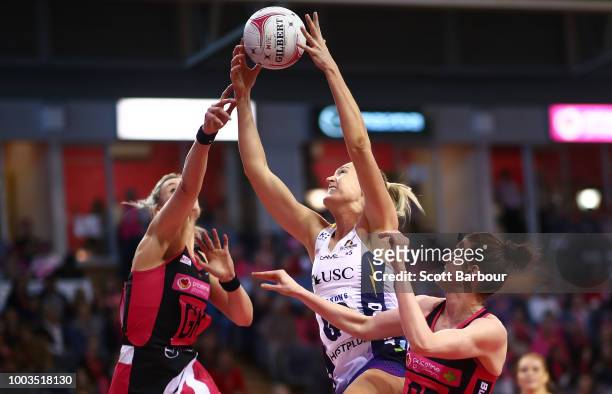 Caitlin Bassett of the Lightning and Kate Shimmin of the Thunderbirds compete for the ball during the Super Netball match between the Thunderbirds...