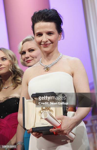 Actress Juliette Binoche poses after winning the Best Actress award for her role in 'Certified Copy' during the Palme d'Or Award Ceremony held at the...