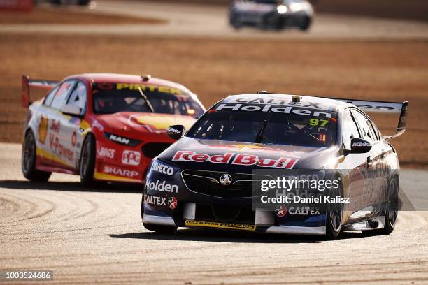 Shane Van Gisbergen drives the Red Bull Holden Racing Team Holden Commodore ZB leads Scott McLaughlin drives the Shell V-Power Racing Team Ford...