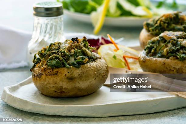 stuffed mushrooms - stuffing stock pictures, royalty-free photos & images