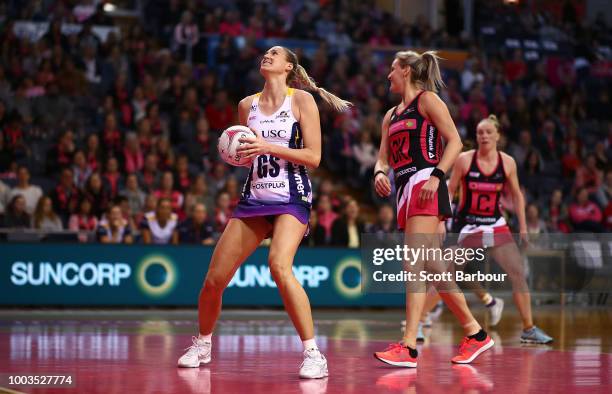 Caitlin Bassett of the Lightning competes for the ball during the Super Netball match between the Thunderbirds and the Lightning at Priceline Stadium...