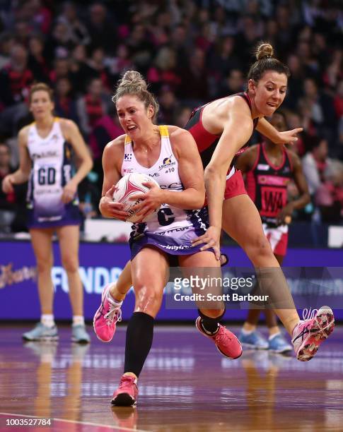 Laura Scherian of the Lightning controls the ball during the Super Netball match between the Thunderbirds and the Lightning at Priceline Stadium on...
