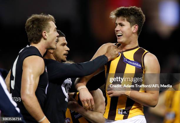Patrick Cripps and Sam Petrevski-Seton of the Blues remonstrate with Daniel Howe of the Hawks after Howe struck Cripps before a ball up during the...